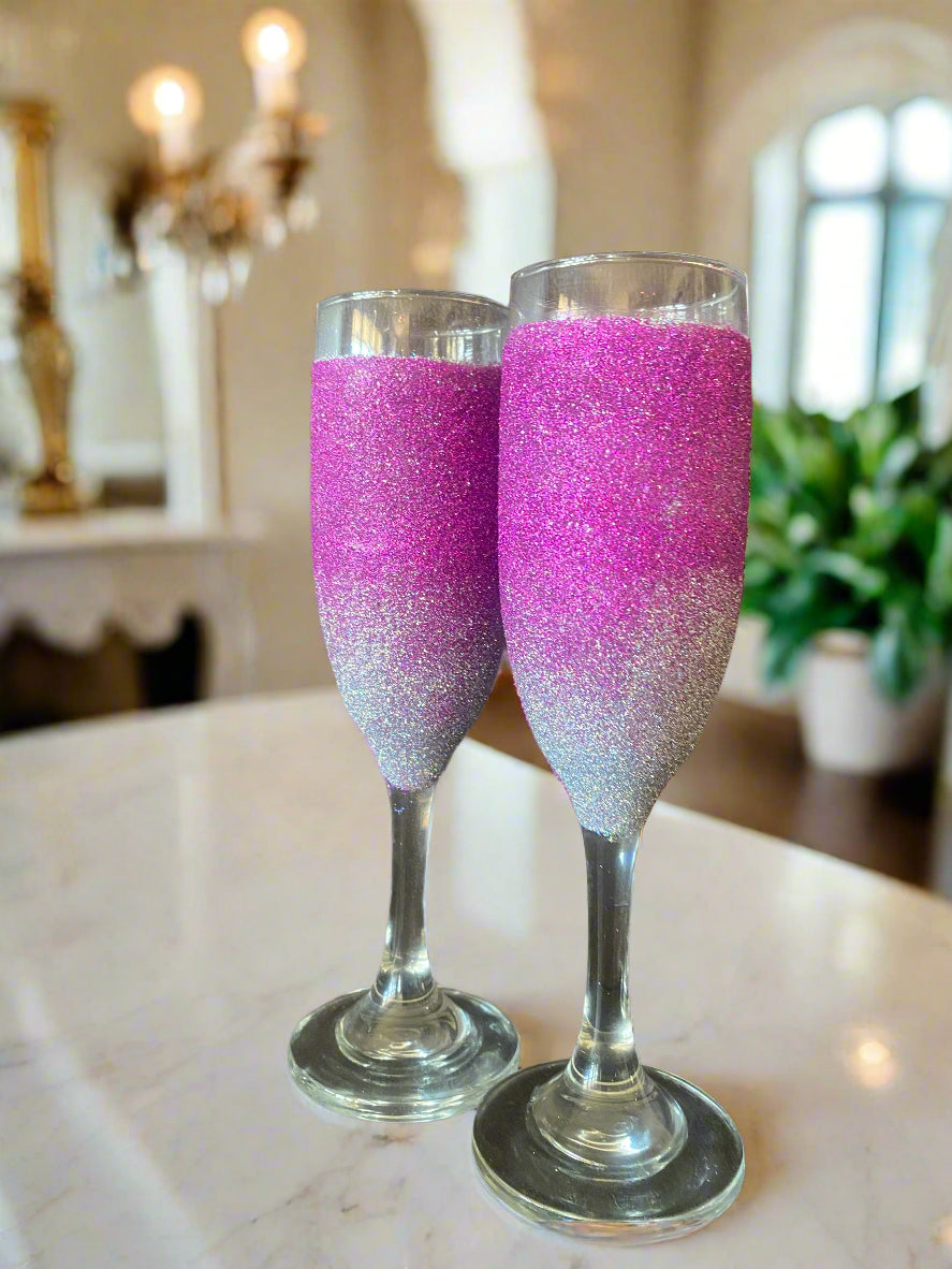 Pink and silver glittered champagne glasses